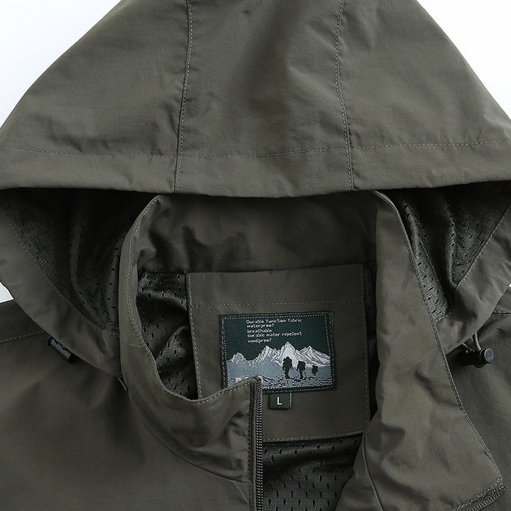 Herren leichte wind- und wasserabweisende Softshelljacke mit Kapuze, Brustreißverschluss und verstellbaren Ärmelabschlüssen Drune