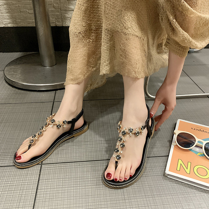 Damen nan flache T-Riemen-Sandalette mit funkelnder Schmuckkette, elastischem Fersenband und gepolstertem Fußbett Drune