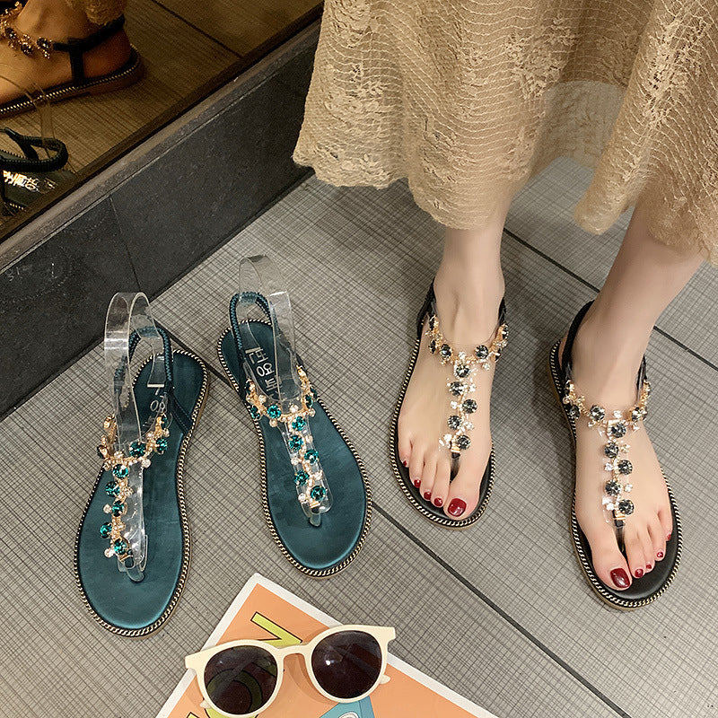 Damen nan flache T-Riemen-Sandalette mit funkelnder Schmuckkette, elastischem Fersenband und gepolstertem Fußbett Drune