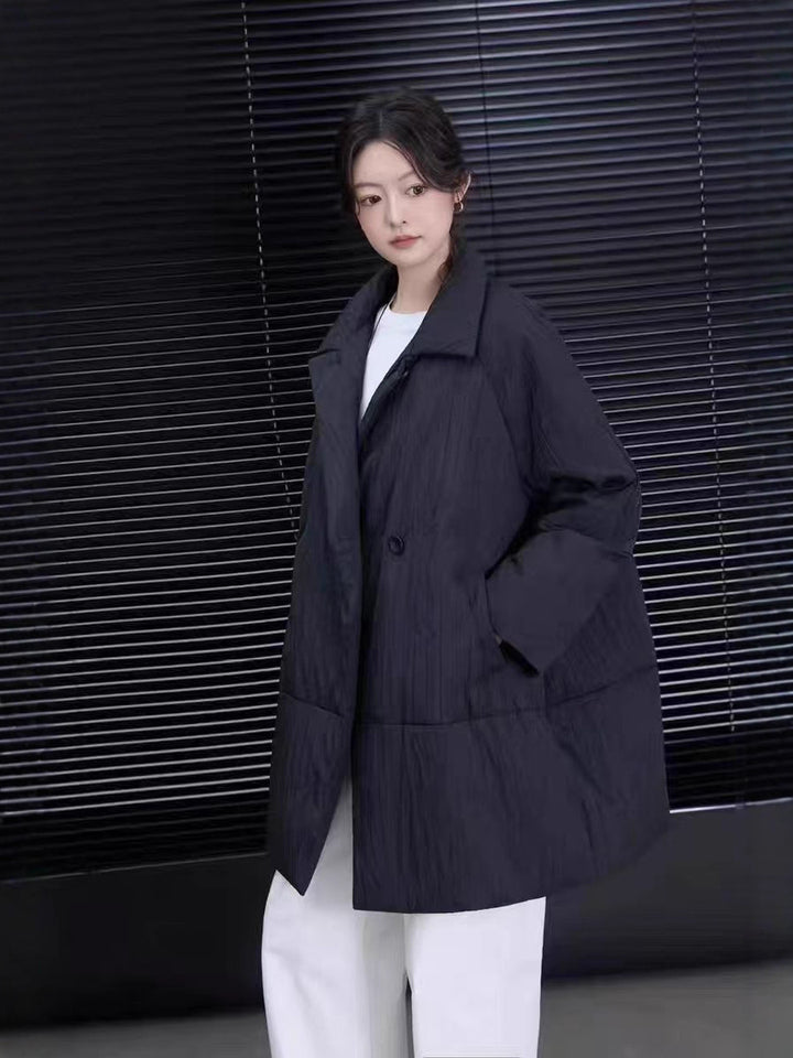 Mittellange Daunenjacke mit Revers, Weißentendaunen