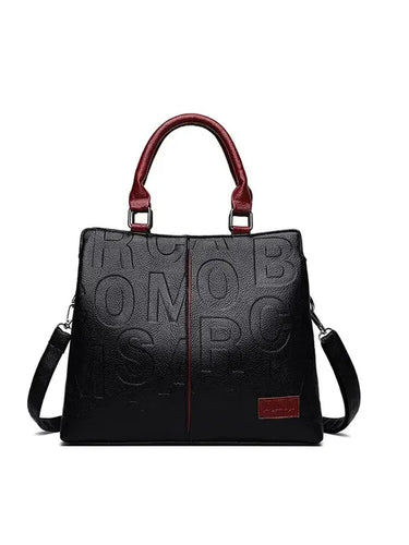 Drune – Damenhandtasche aus weichem Leder mit geprägtem Buchstabendesign