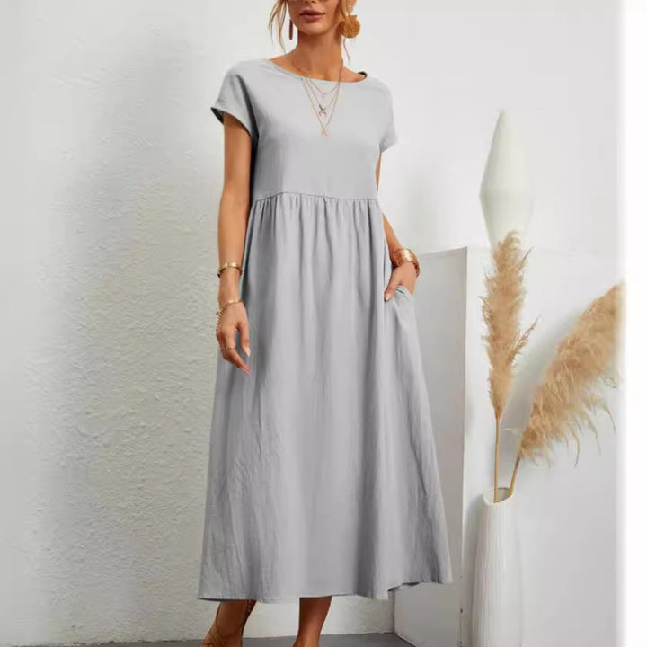 Drune | Einfarbiges ärmelloses lockeres Taschenkleid