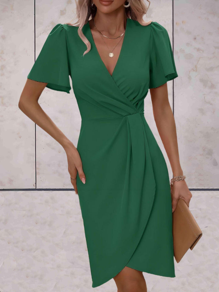 elegante wikkeljurk met korte mouwen
