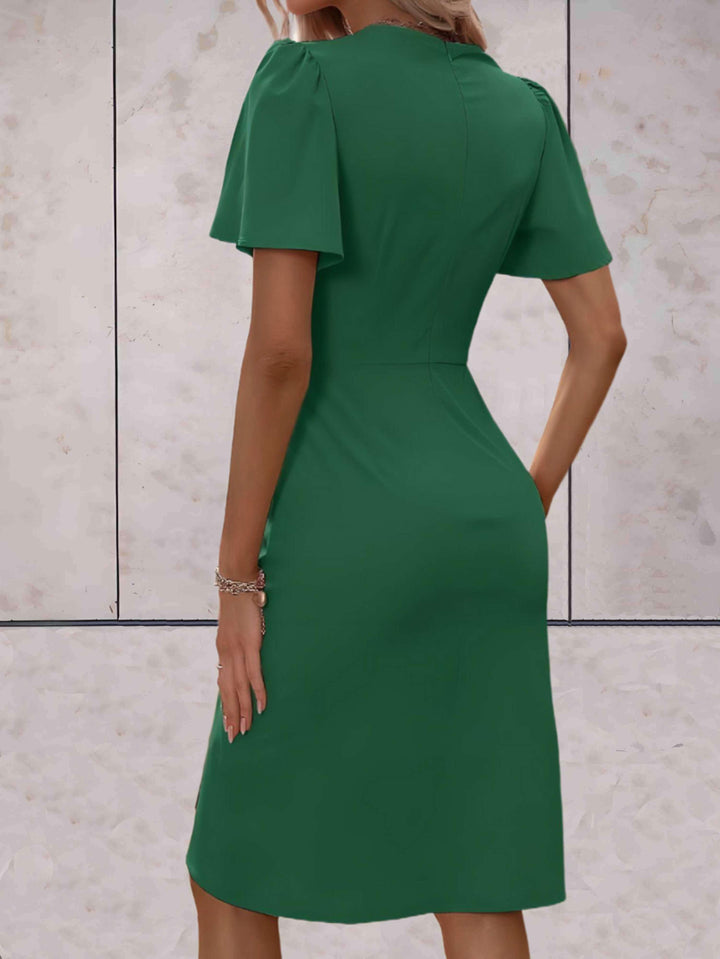 elegante wikkeljurk met korte mouwen