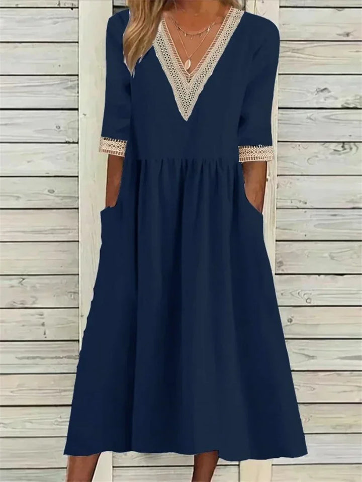 Kleid mit Spitzenverzierung und halben Ärmeln
