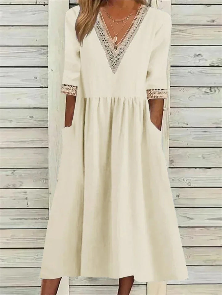 Kleid mit Spitzenverzierung und halben Ärmeln