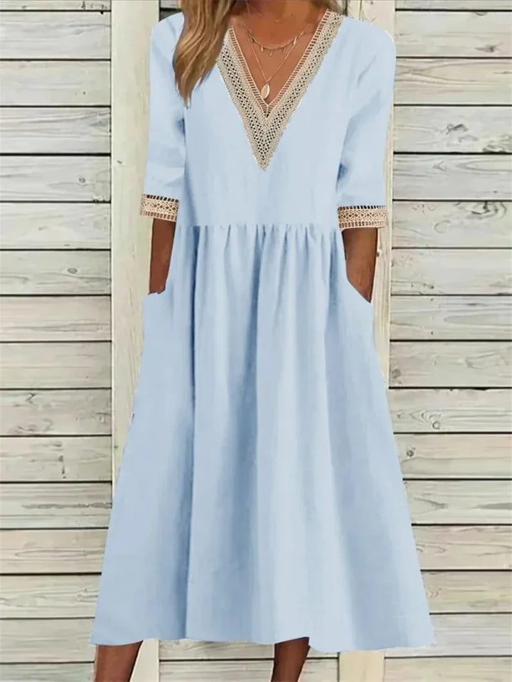 Kleid mit Spitzenverzierung und halben Ärmeln