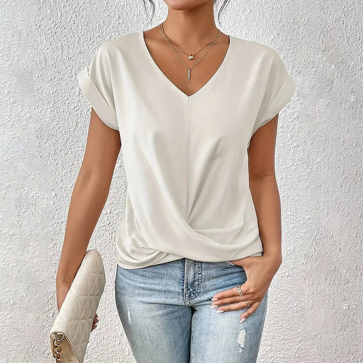 Drune | Elegantes, einfarbiges T-Shirt mit V-Ausschnitt und gedrehtem Saum für Damen