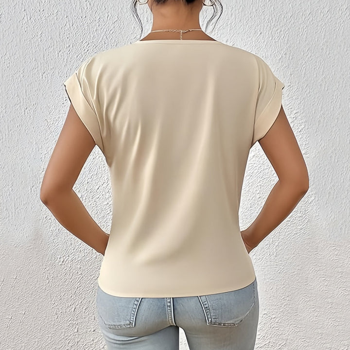 Drune | Elegantes, einfarbiges T-Shirt mit V-Ausschnitt und gedrehtem Saum für Damen