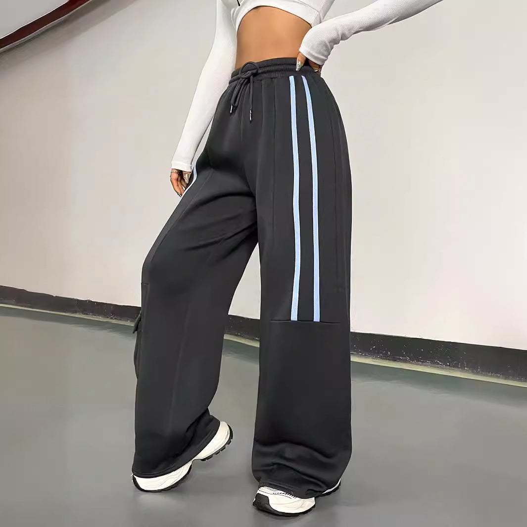 Damen weite Sporthose im urbanen Streetwear-Stil mit elastischem Bund und praktischen Taschen Drune