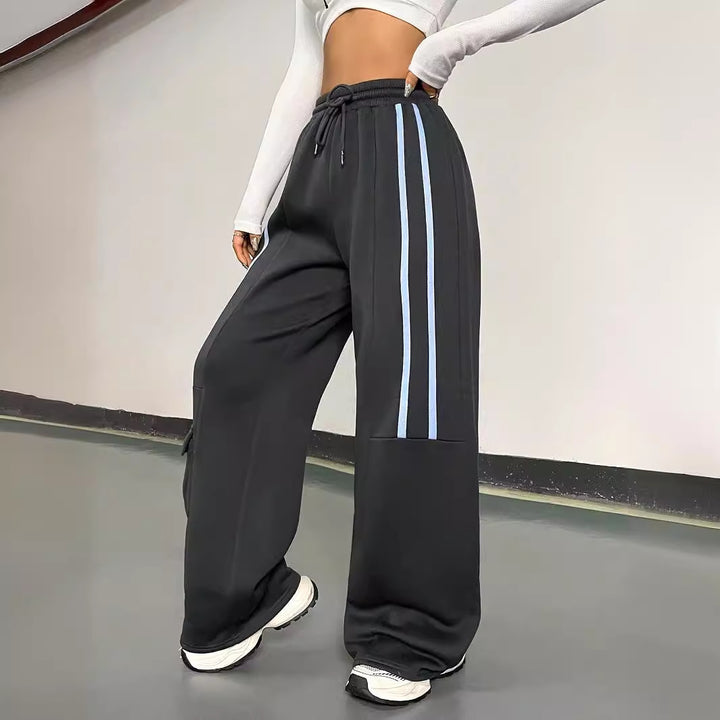 Damen weite Sporthose im urbanen Streetwear-Stil mit elastischem Bund und praktischen Taschen Drune