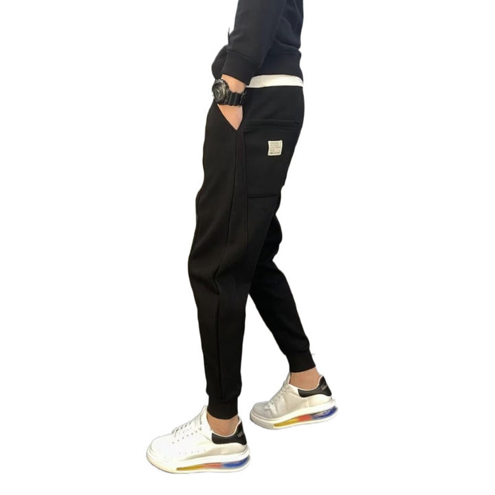 Herren Jogginghose mit tailliertem Tapered‑Schnitt, Bügelfalte und elastischen Bündchen Drune