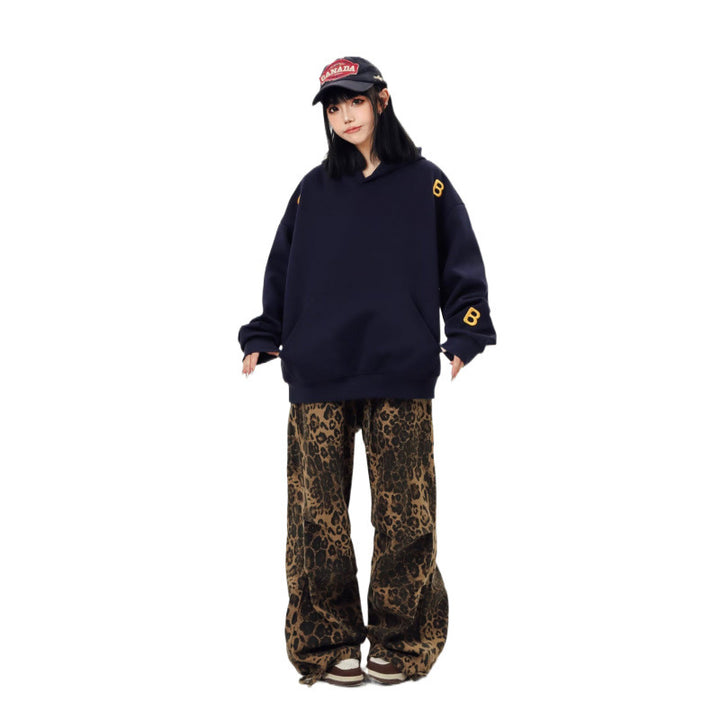Unisex Oversized Kapuzenpullover mit großflächigem Intarsien‑Blockprint und geripptem Saum Drune