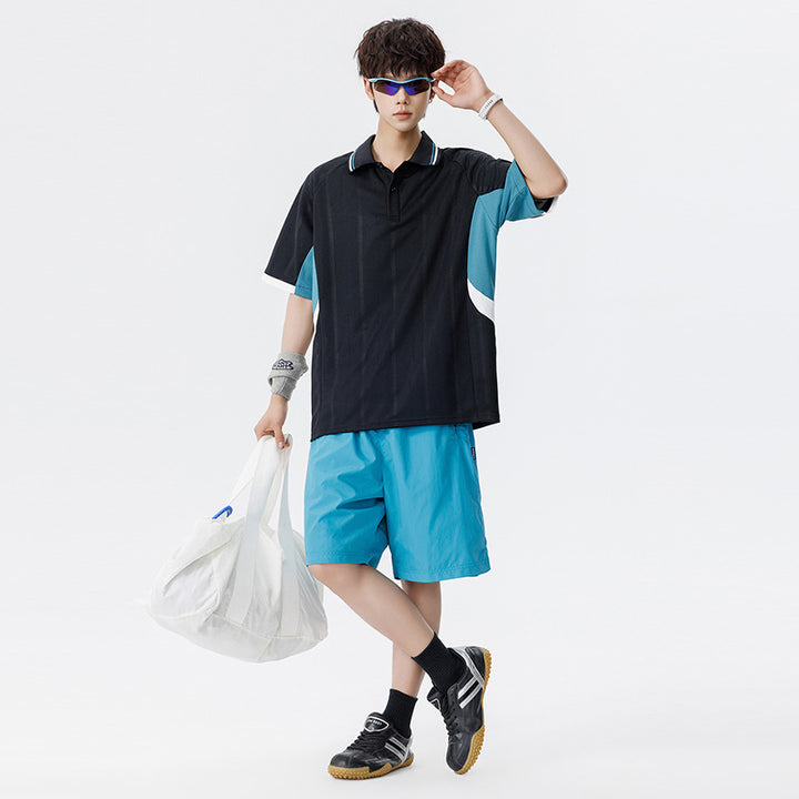 Unisex Boxy Oversize Polo-Shirt aus technischem Funktionsjersey mit Kontrastpaneelen und Raglanärmeln Drune