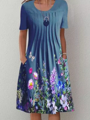 Damen Plissee Midi Kleid mit kurzen Ärmeln, seitlichen Taschen und floralem Saum Drune