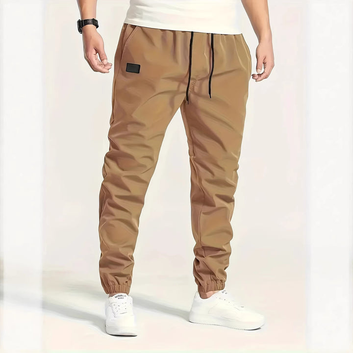 Herren Technische Jogginghose im Tapered‑Utility‑Stil mit elastischem Bund & Knöchelbündchen Drune