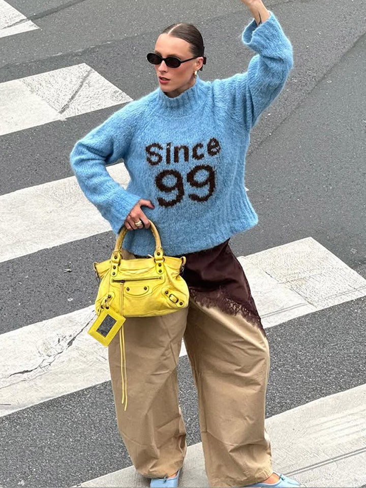 Damen Oversized Strickpullover mit hohem Kragen und einzigartigem Schriftzug Drune