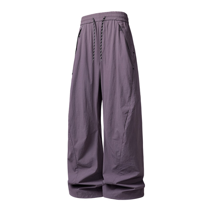 Unisex Weite Tech-Baggy-Hose mit elastischem Kordbund, Reißverschlusstaschen & wasserabweisender Nylonoptik Drune