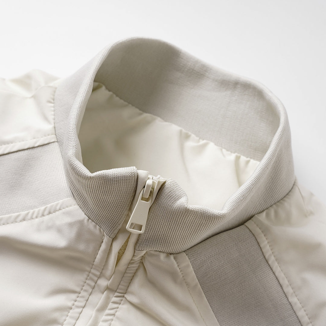 Damen Minimalistische leichte Nylon-Bomberjacke mit Rippkragen, Raglanärmeln & elastischem Saum Drune