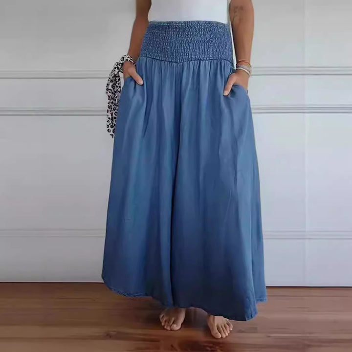 Damen-Maxi-Rock mit hohem Smockbund, weitem Fall und seitlichen Taschen Drune