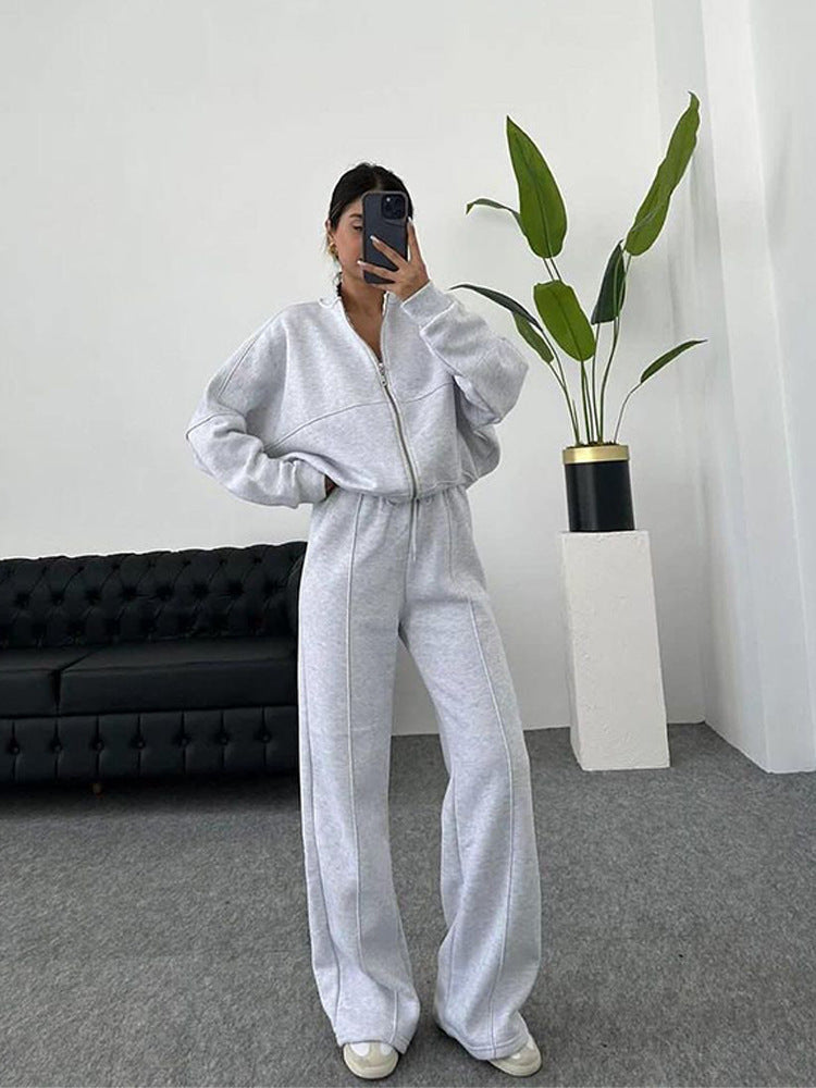 Damen sportive Oversize-Fleecejacke mit diagonaler Reißverschluss-Optik und weit geschnittener High-Waist-Jogginghose Drune