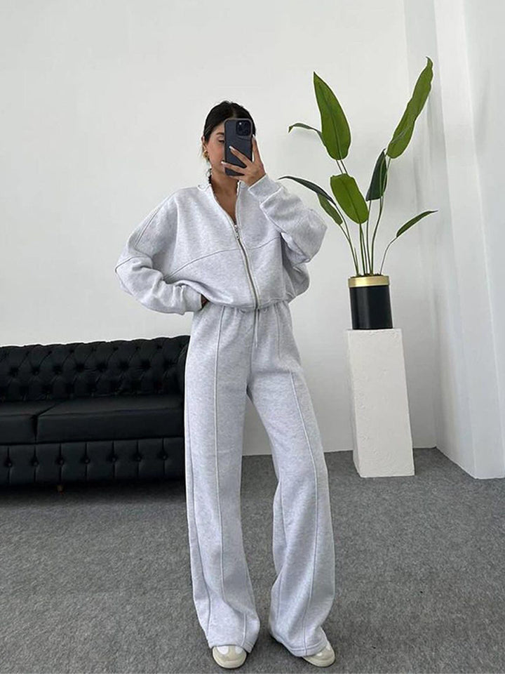 Damen sportive Oversize-Fleecejacke mit diagonaler Reißverschluss-Optik und weit geschnittener High-Waist-Jogginghose Drune