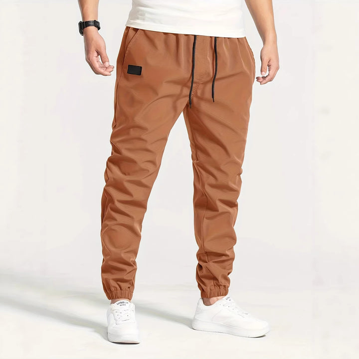 Herren Technische Jogginghose im Tapered‑Utility‑Stil mit elastischem Bund & Knöchelbündchen Drune