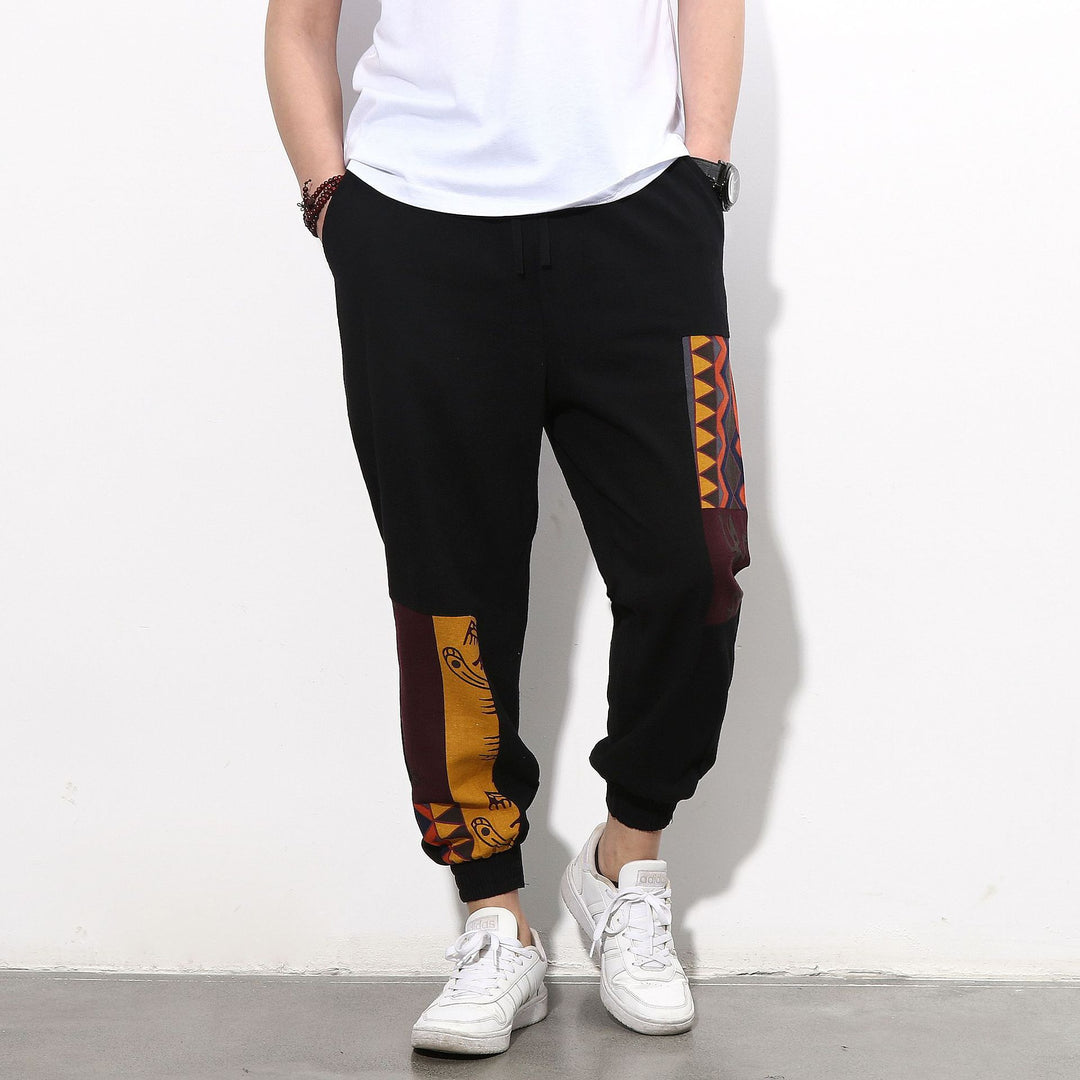 Herren Jogginghose mit seitlichen Panel-Prints, Tunnelzug und gerippten Bündchen Drune