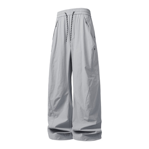 Unisex Weite Tech-Baggy-Hose mit elastischem Kordbund, Reißverschlusstaschen & wasserabweisender Nylonoptik Drune