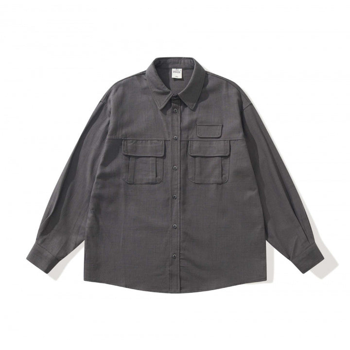 Unisex Boxy-Overshirtjacke im Utility‑Stil mit aufgesetzten Klappentaschen und Hemdkragen Drune