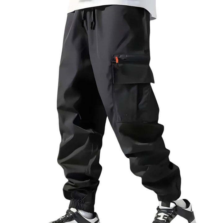 Herren Technische Cargo-Jogginghose mit Reißverschlusstaschen, Tunnelzug und elastischen Knöchelbündchen Drune