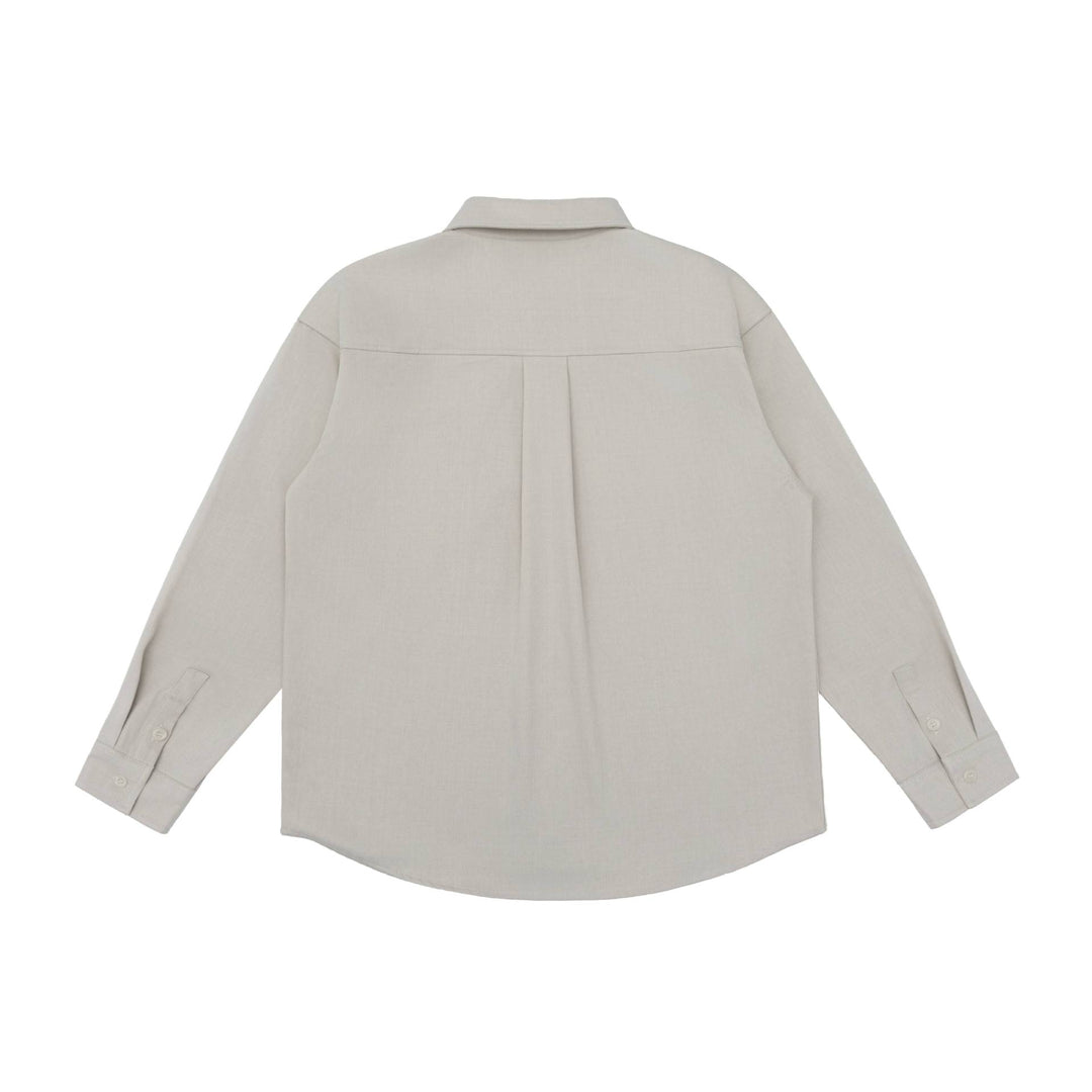 Unisex Oversize Hemdjacke im minimalistischen Workwear Stil mit gerundetem Saum und Brustpattentasche Drune