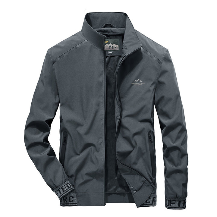 Herren Softshelljacke mit reflektierenden Einsätzen, wasserabweisenden Reißverschlusstaschen und hohem Stehkragen Drune