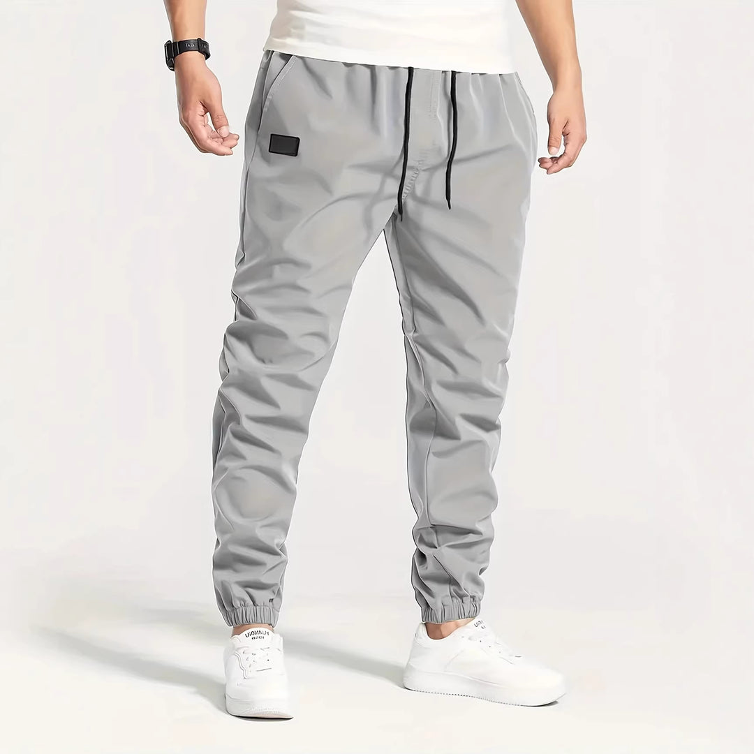 Herren Technische Jogginghose im Tapered‑Utility‑Stil mit elastischem Bund & Knöchelbündchen Drune