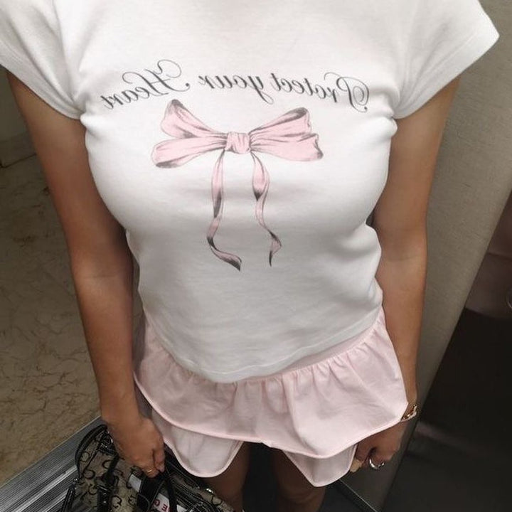 Damen Crop-Top mit kreativem Schleifenmotiv und inspirierendem Schriftzug Drune