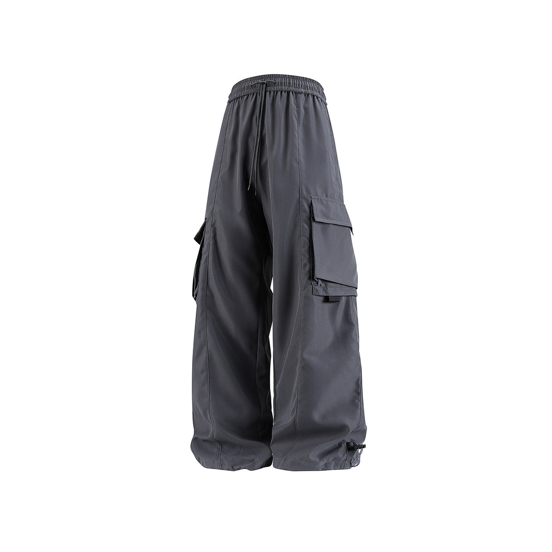Herren weite Utility‑Cargohose im Baggy‑Cut mit Tunnelzugbund, großen Klappentaschen und verstellbarem Beinabschluss Drune