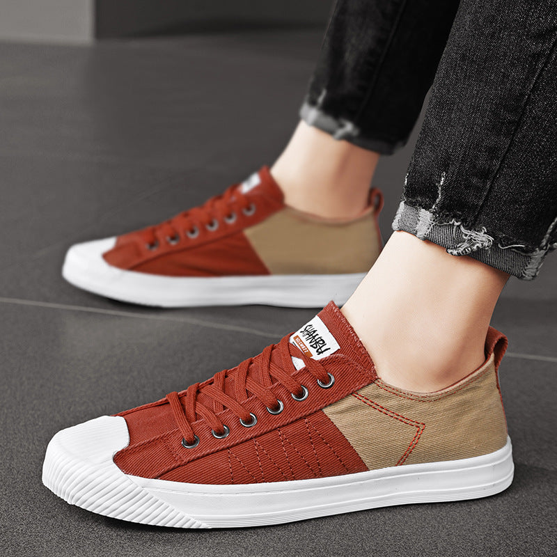 Unisex niedrige Canvas-Sneaker mit verstärkter Gummi-Zehenkappe und kontrastierenden Textilpaneelen Drune