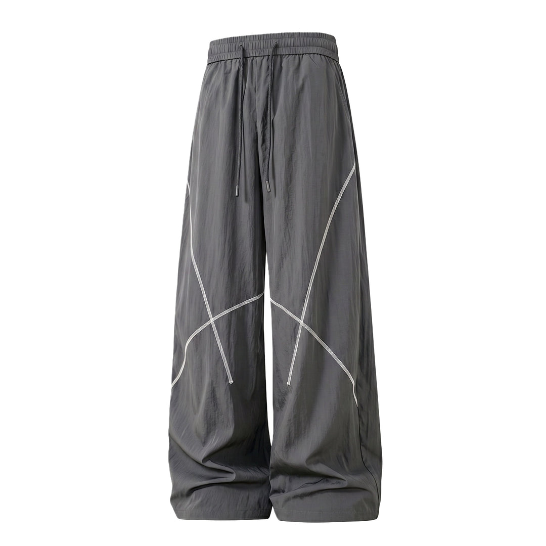 Herren Weite Funktions-Nylonhose mit Kordelbund, reflektierenden Nahtdetails & lässiger Baggy‑Silhouette Drune