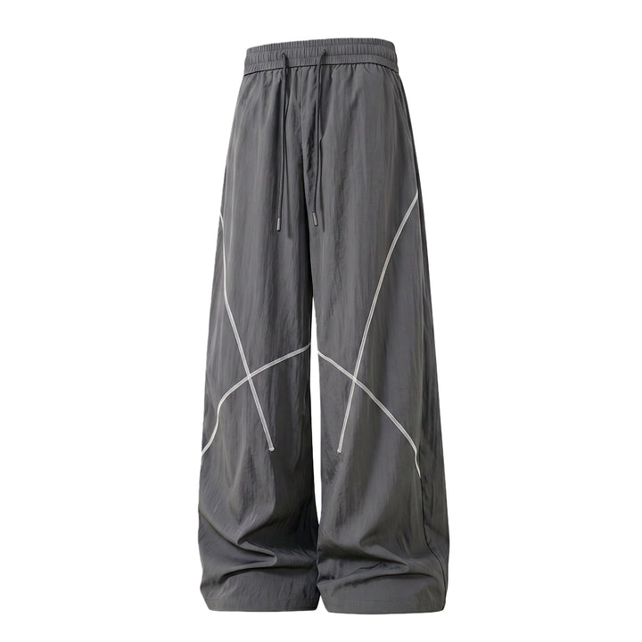 Herren Weite Funktions-Nylonhose mit Kordelbund, reflektierenden Nahtdetails & lässiger Baggy‑Silhouette Drune