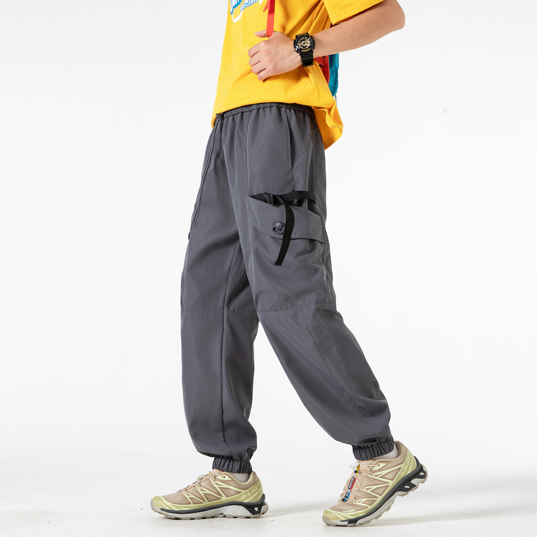 Unisex Weite Technical-Cargo-Jogginghose mit verstellbarem Tunnelzug, großen Klapptaschen und elastischem Knöchelabschluss Drune