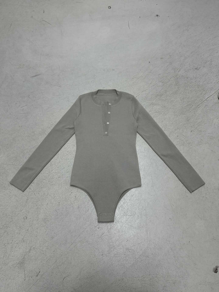 Damen Langarm Bodysuit mit Knopfdetail und strukturiertem Material Drune
