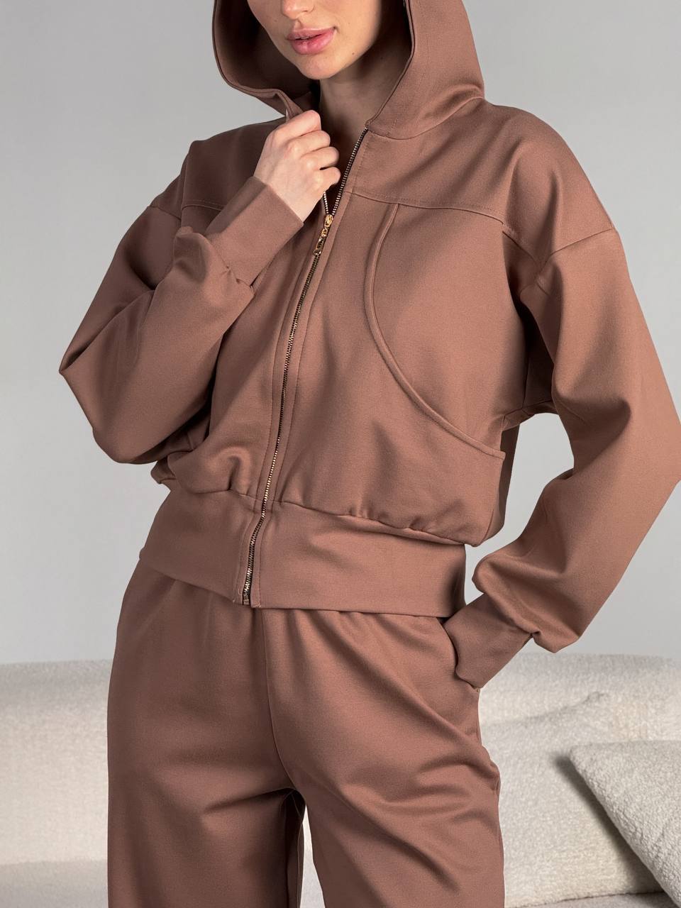 Damen kurz geschnittene Reißverschluss-Kapuzenjacke mit überschnittener Schulter, tiefen Eingrifftaschen und elastischem Bund Drune