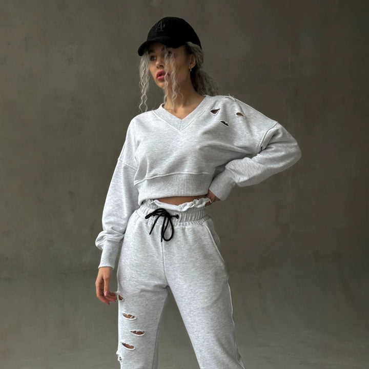 Damen kurzgeschnittenes Sweat-Set mit V-Ausschnitt, Rüschenbund Highwaist Jogginghose und Distressed-Details Drune