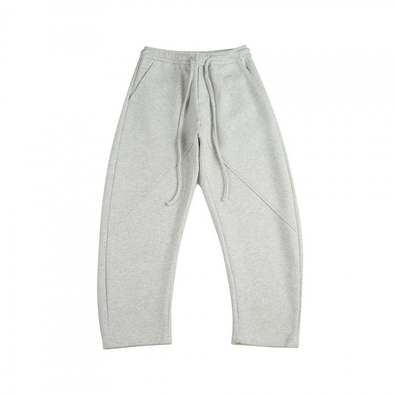 Unisex Weite Tech-Jogginghose mit diagonalem Nahtdesign, Elastikbund und Tunnelzug Drune