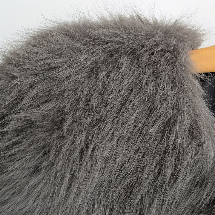Damen Kurze Kunstfelljacke mit voluminösen Ärmeln und Rundhalsausschnitt Drune