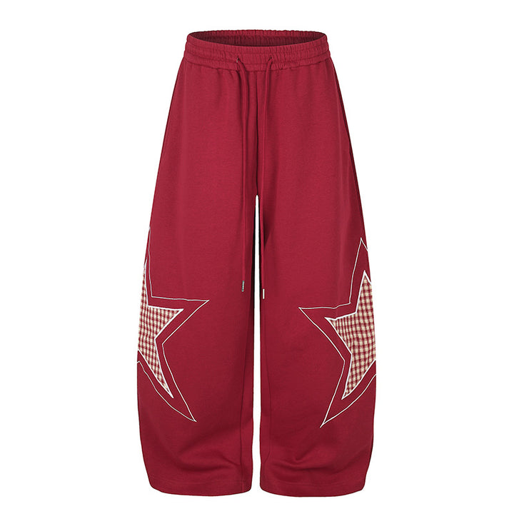 Damen weite Palazzo-Sweathose mit Stern-Applikationen und Karo‑Einsätzen Drune