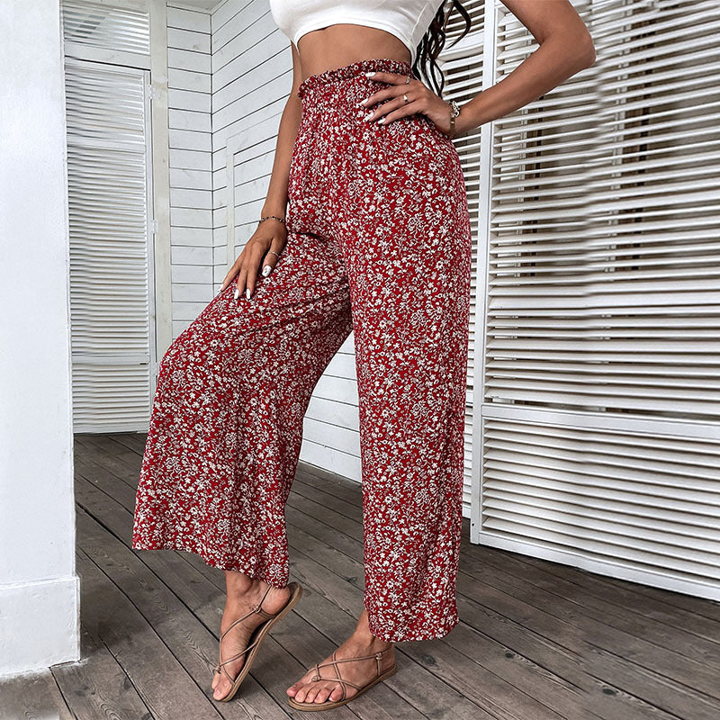 Damen Weite hochgeschnittene Palazzo‑Hose mit floralem Muster und seitlichem Beinschlitz Drune