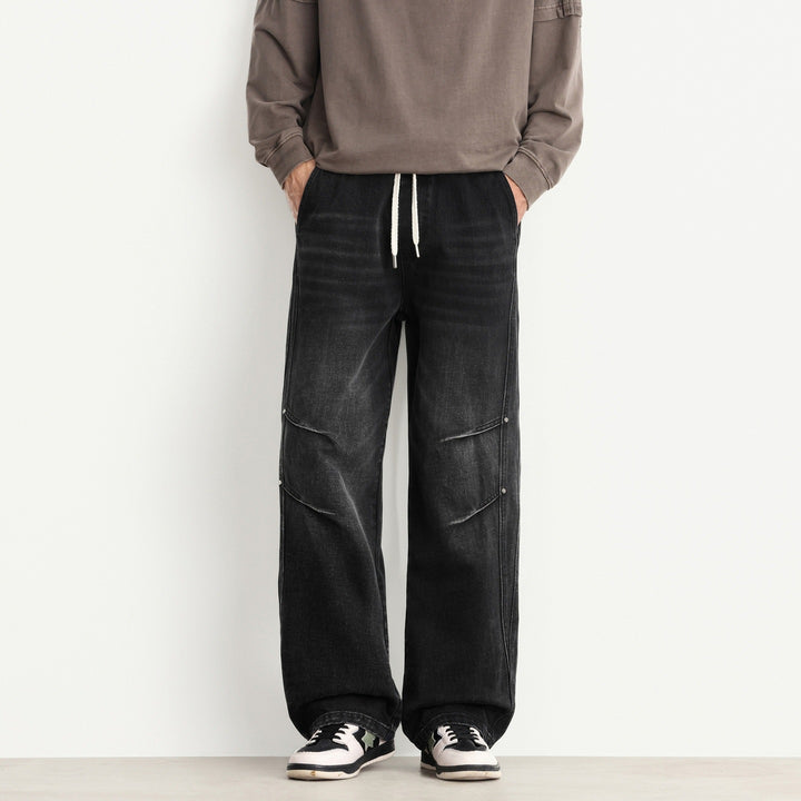 Herren Weite Denim-Hose mit Tunnelzugbund, Paneelnähten und Used-Waschung Drune