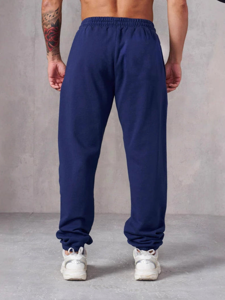 Herren Baggy Jogginghose mit elastischem Bund und seitlichen Taschen Drune