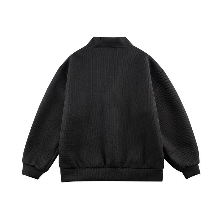 Unisex Boxy-Strickjacke im Waffelstrick mit V-Kragen, durchgehender Knopfleiste und aufgesetzten Rundtaschen Drune